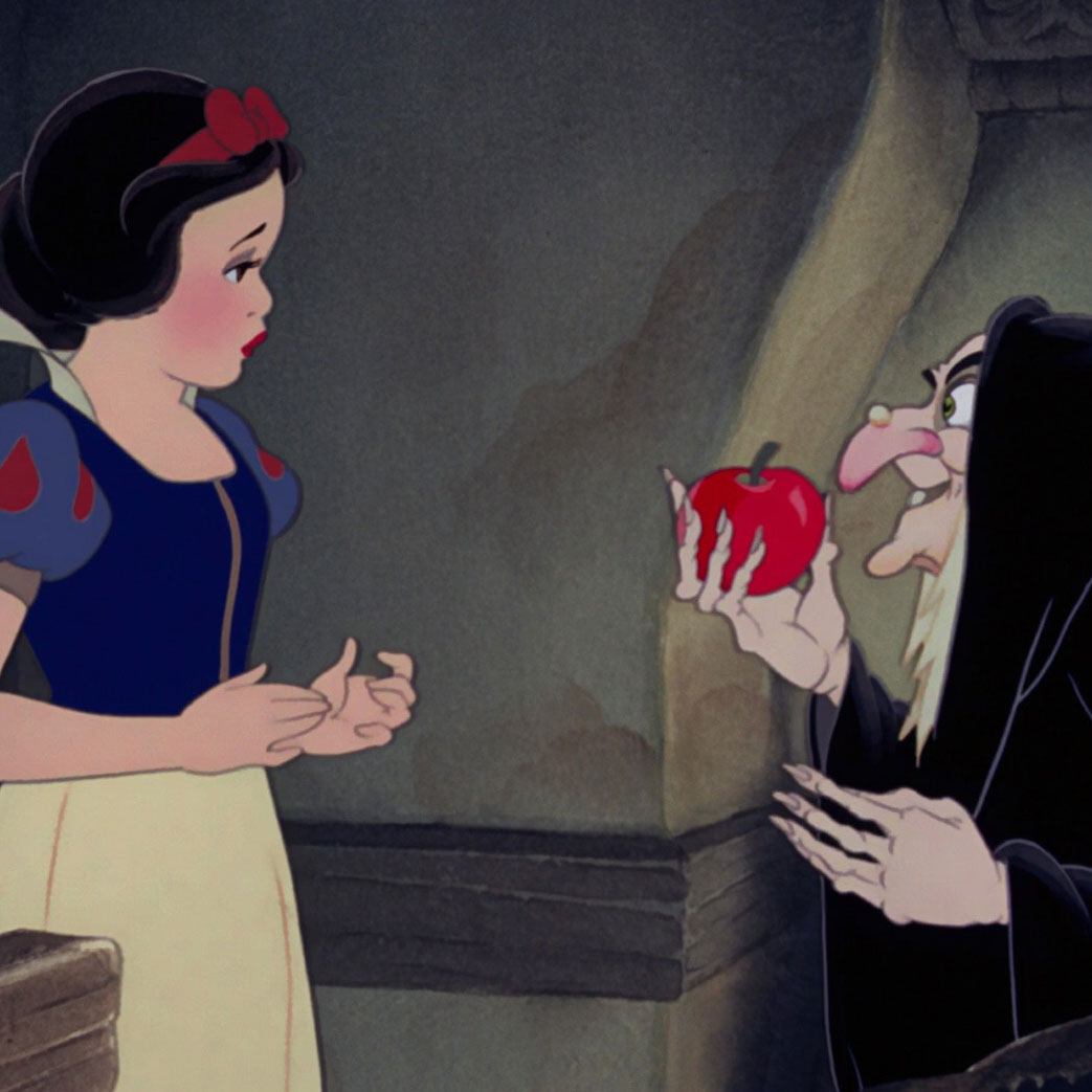 The witch offers Disney's Snow White a bite of the apple