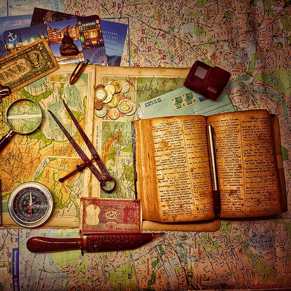 Treasure hunting goodies, including a map, compass, diary, and money.